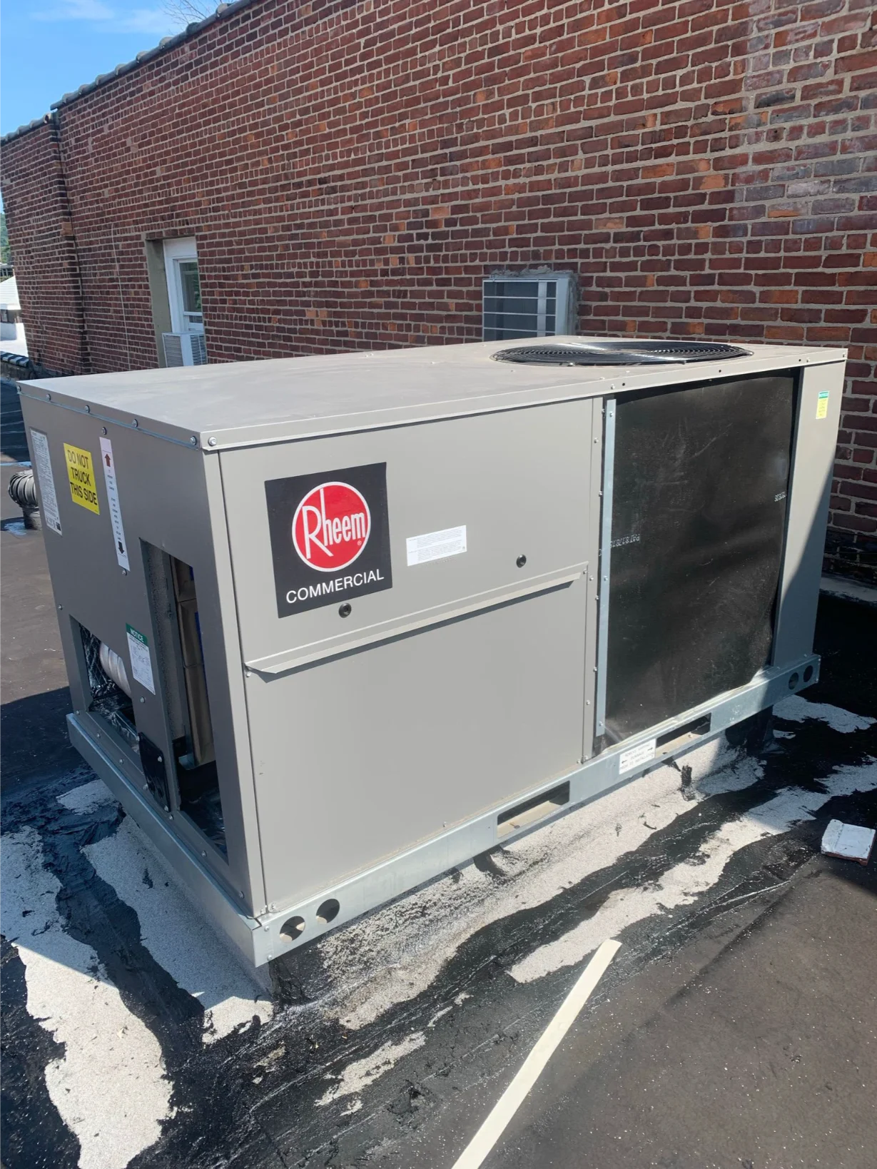 Close-up of a newly installed Rheem Commercial rooftop HVAC unit