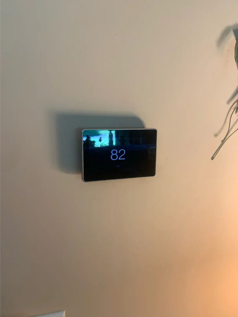 Modern Smart Thermostat Displaying 82